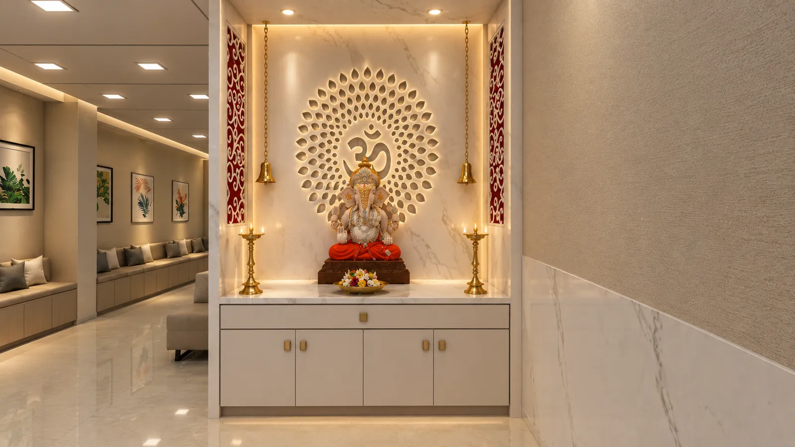 A prayer niche with a carved backlit panel and a Ganesha idol set into a marble wall beside a waiting area